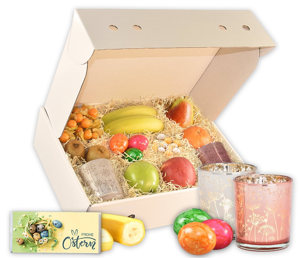 Obstbox Osterlicht mit Windlichtern, Holzeiern, Lindt Goldhasen und frischem Obst